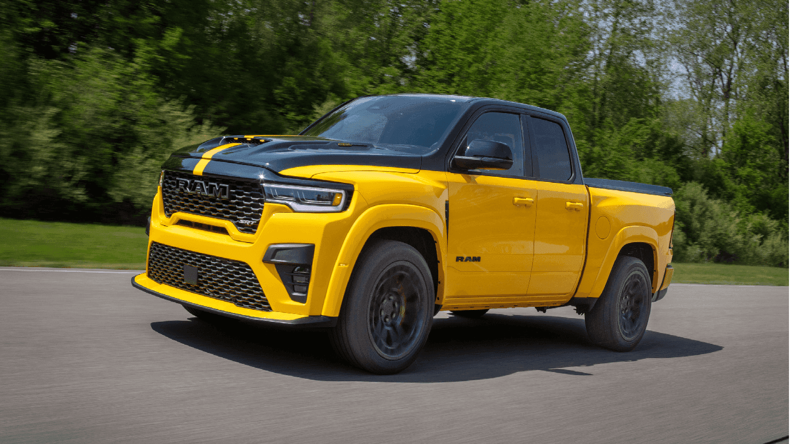 2027 Ram 1500 Rumble Bee street truck with wide-body stance, side view.