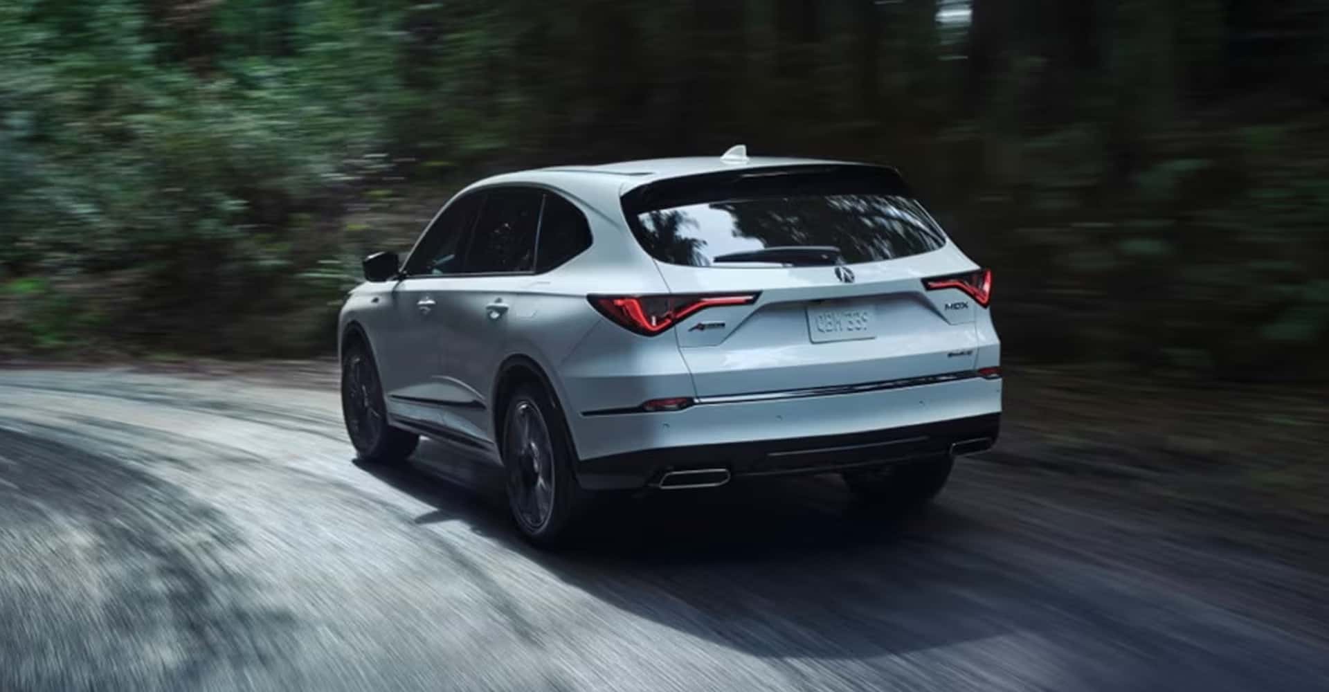 2026 Acura MDX cornering in the rain