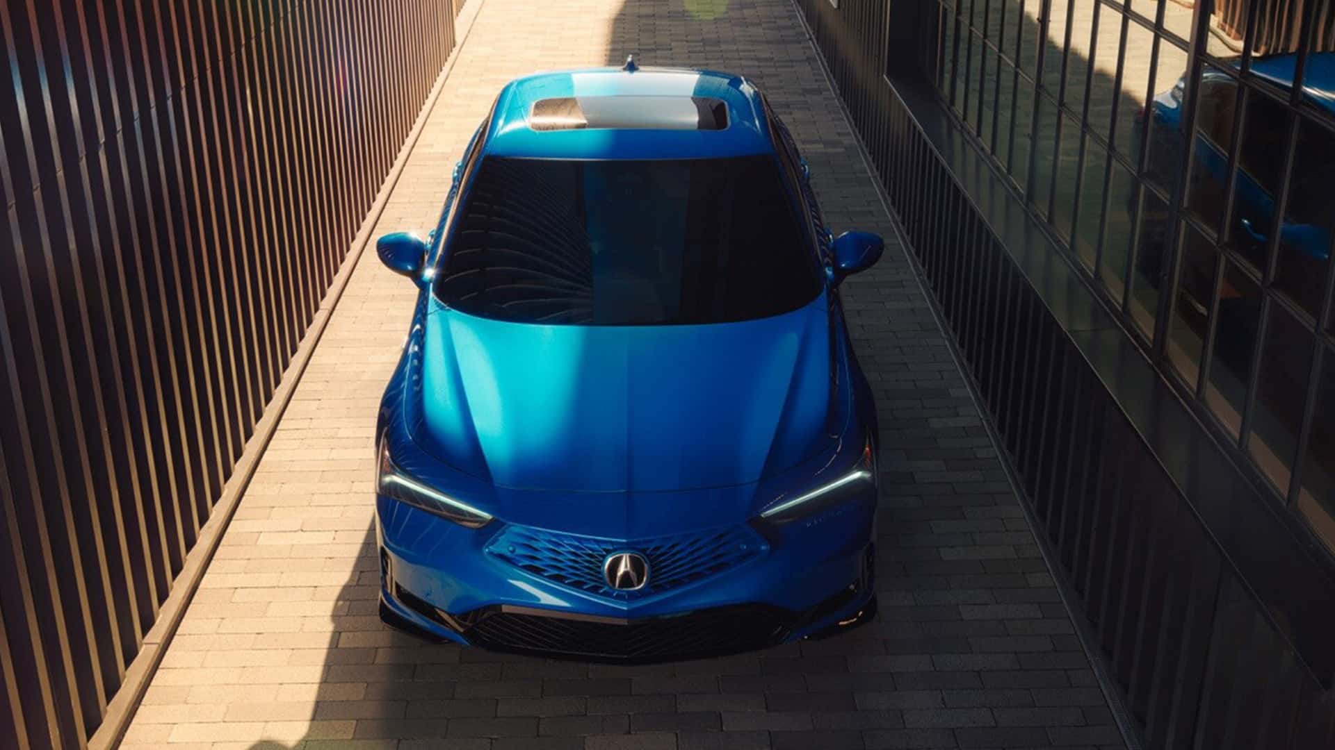 Blue 2026 Acura Integra Between Buildings