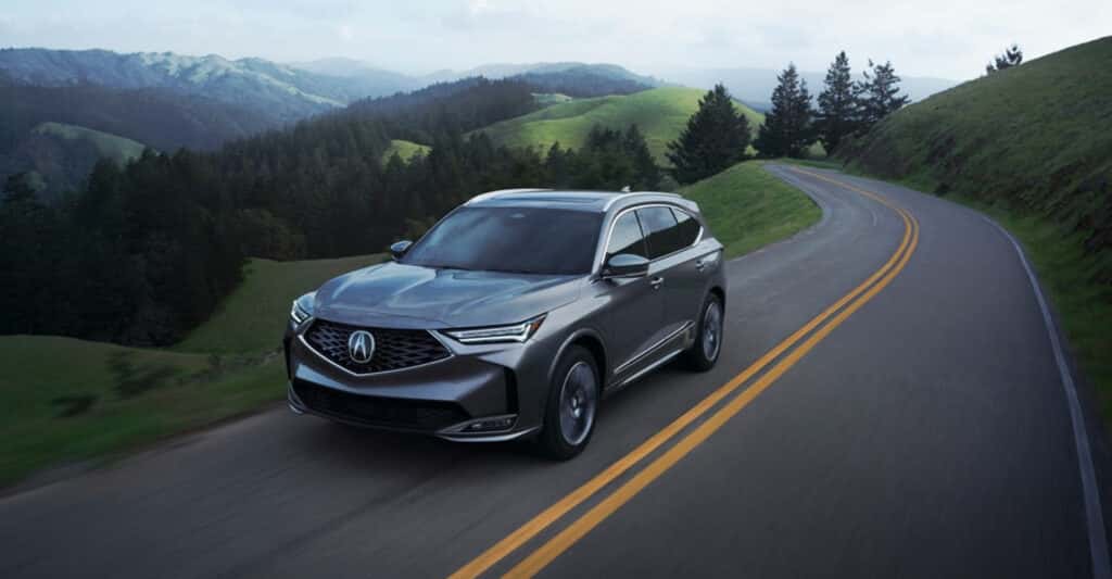 2026-Acura-MDX-driving-cloudy