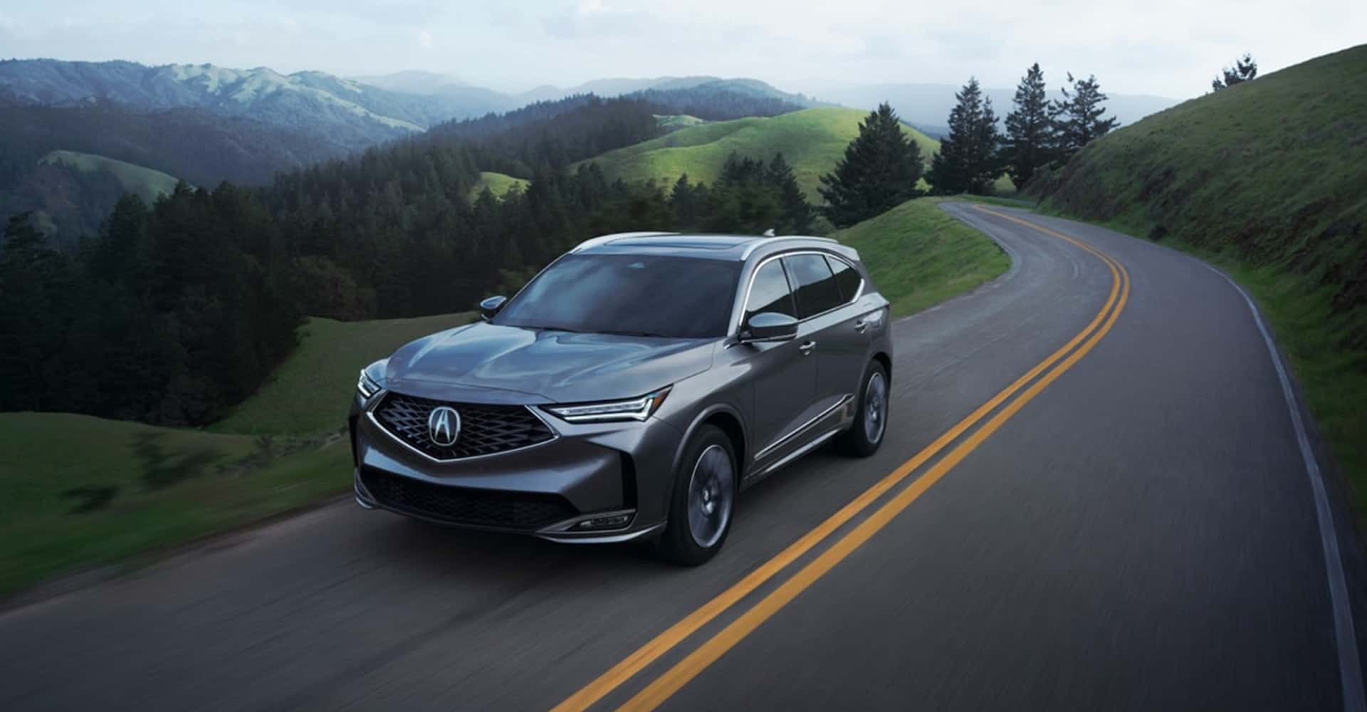 2026-Acura-MDX-driving-cloudy
