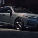 Side view 2026 Acura Integra driving in city