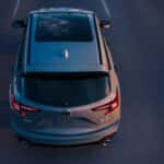 2026 Acura RDX driving during sunset