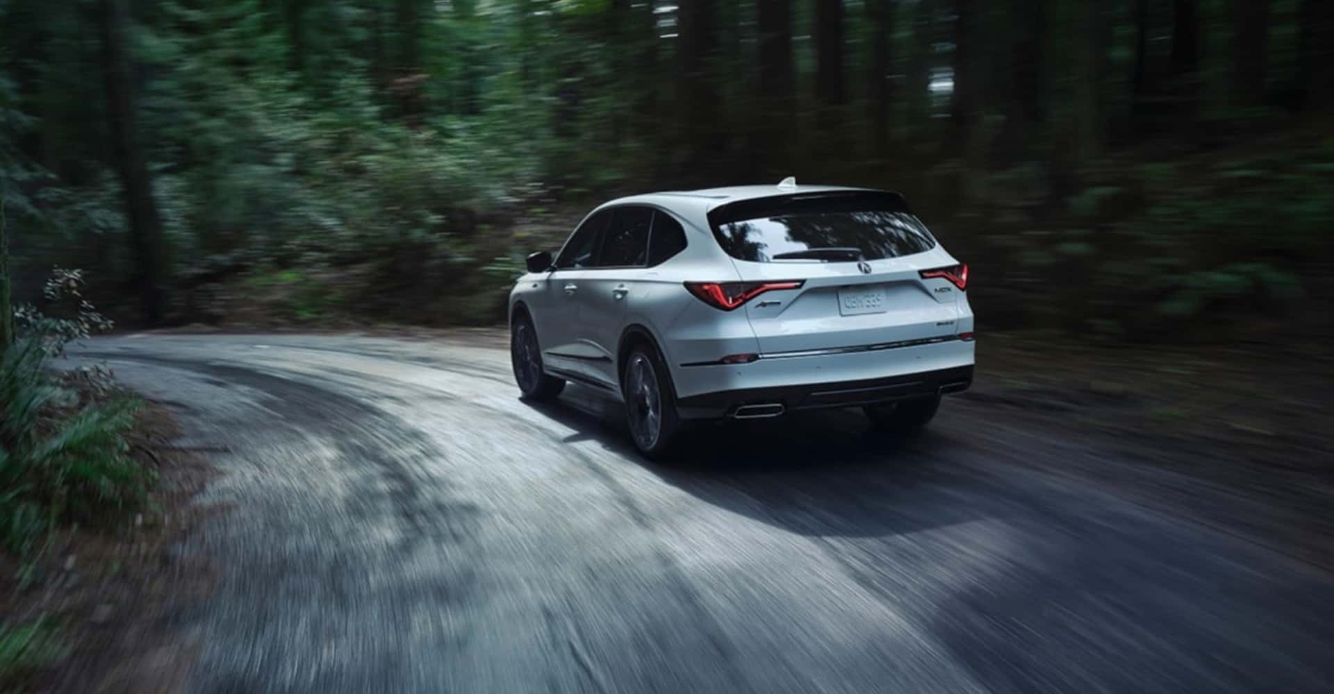 2026 Acura MDX in white driving