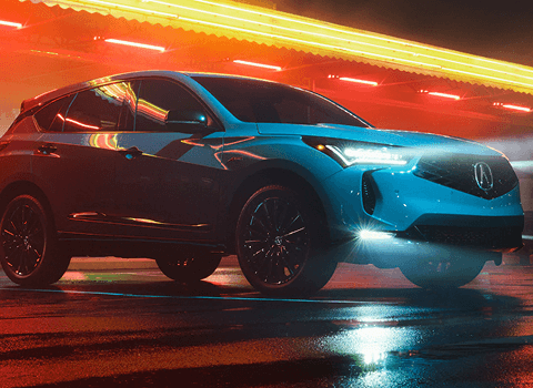 2026 Acura RDX front three-quarter view in Apex Blue Pearl