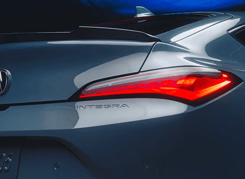 2026 Acura Integra LED taillight detail with INTEGRA badge in Platinum White Pearl