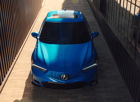 2026 Acura Integra in Apex Blue Pearl shown from above in a narrow alley