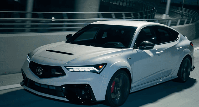 2026 Acura Integra Type S in Platinum White Pearl driving on a highway