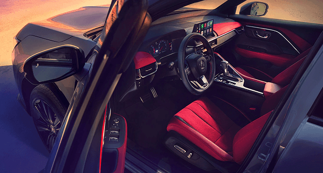 2026 Acura ADX A-Spec interior with red leather seats viewed through open driver door