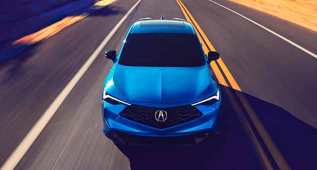 2026 Acura ADX in blue driving on highway, aerial front view