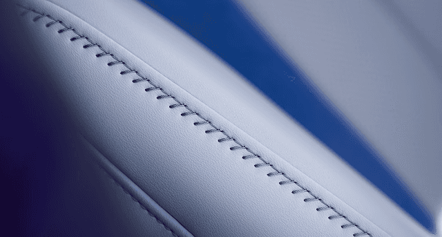 2026 Acura ADX A-Spec seat stitching detail in gray leather with blue piping