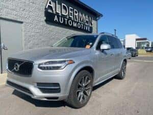 A Top-Of-The-Line Car Parked Outside The Prestigious And Accomplished Alderman Automative
