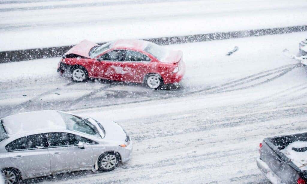 A Car Accident On A Snowy Day On The Highway