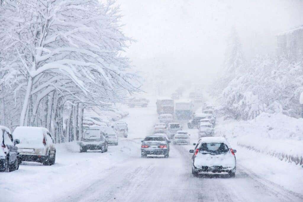 Many Cars Driving In Snow