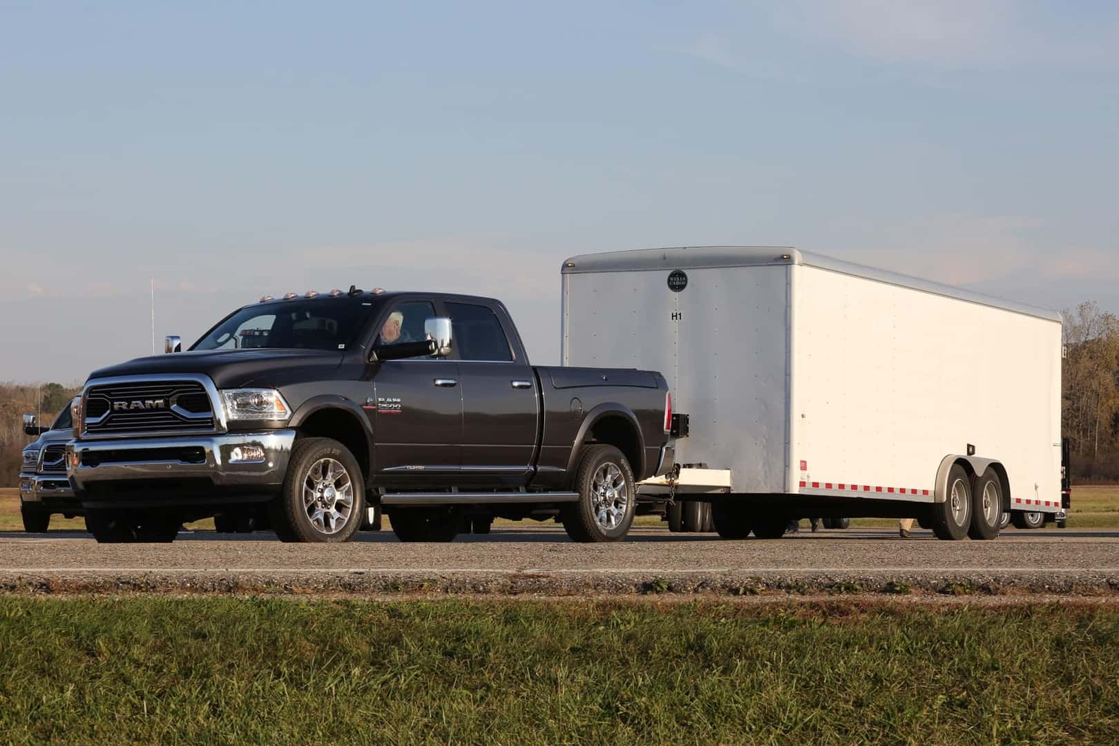 A Strong, Buff, And Sturdy Truck Rolling With A Trailer