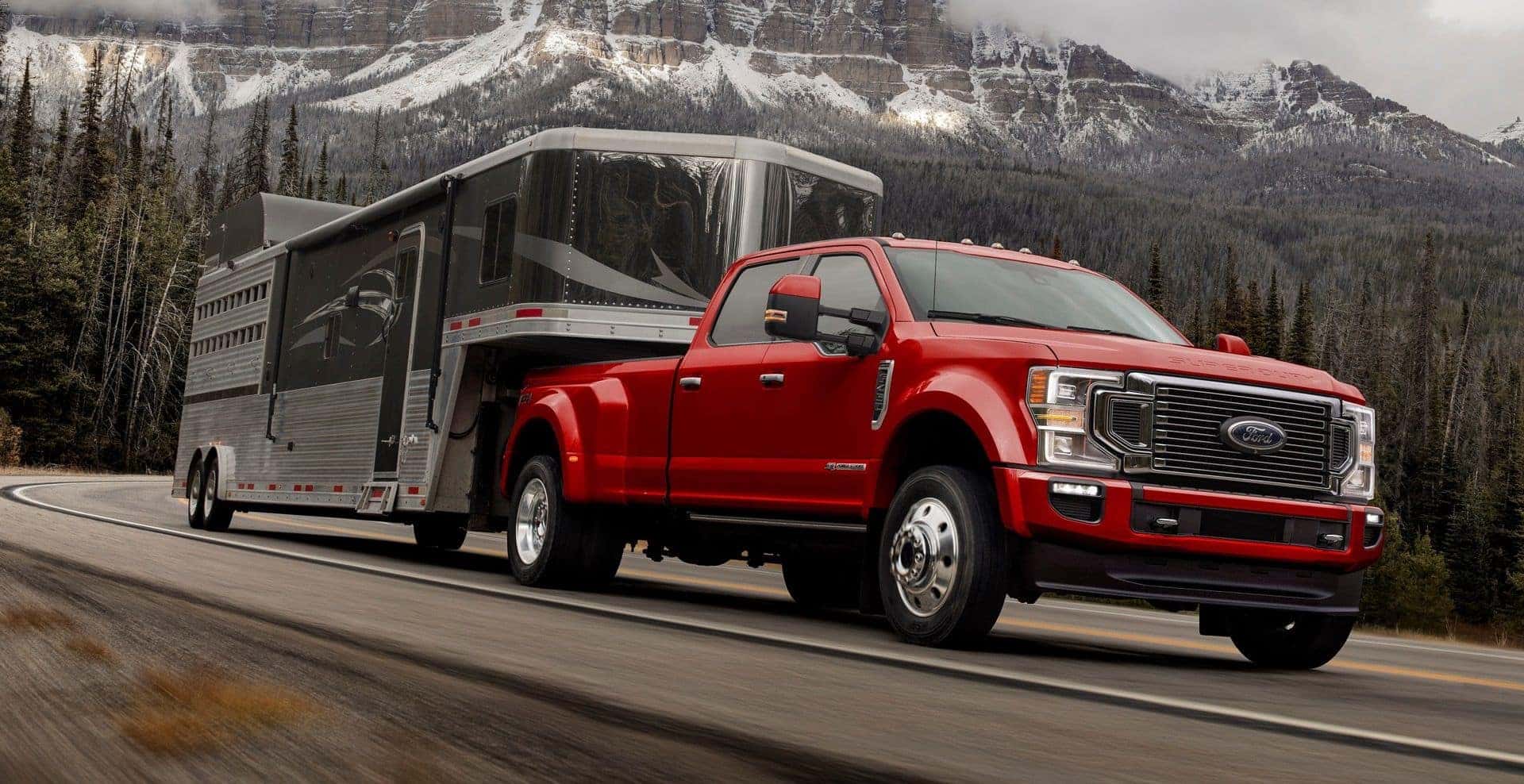 A Scarlet F-450 Hauling A Heavy Trailer
