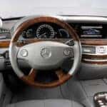 Mercedes Steering Wheel and Gauge Cluster, Infotainment Center in Gray with Wood Accents