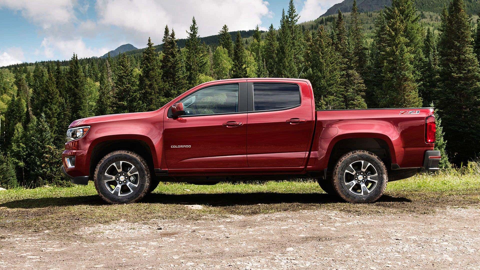 The Side Profile Of The 2016 Chevy Colorado, Parked On The Edge Of A Forest
