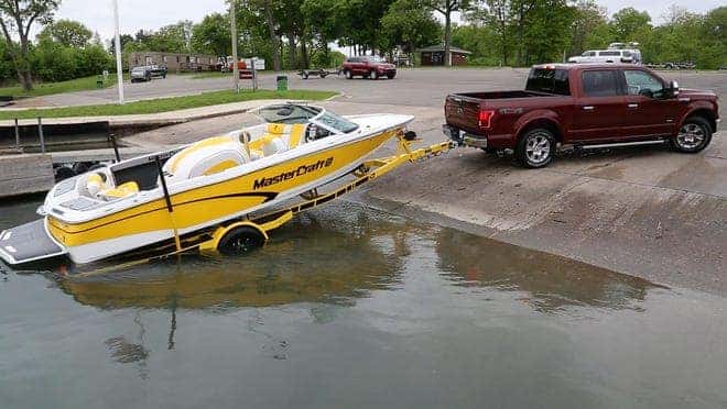 Truck Towing Boat at Boat Loading and Unloading