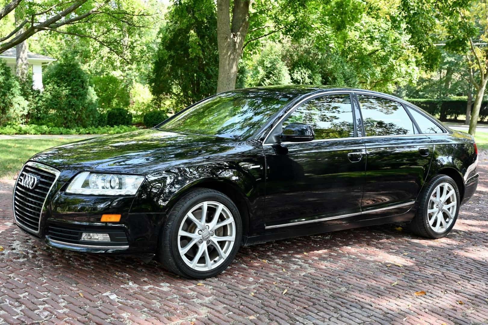 The Fashionable And Affordable 2010 Audi A6, Driving Past A Local Park