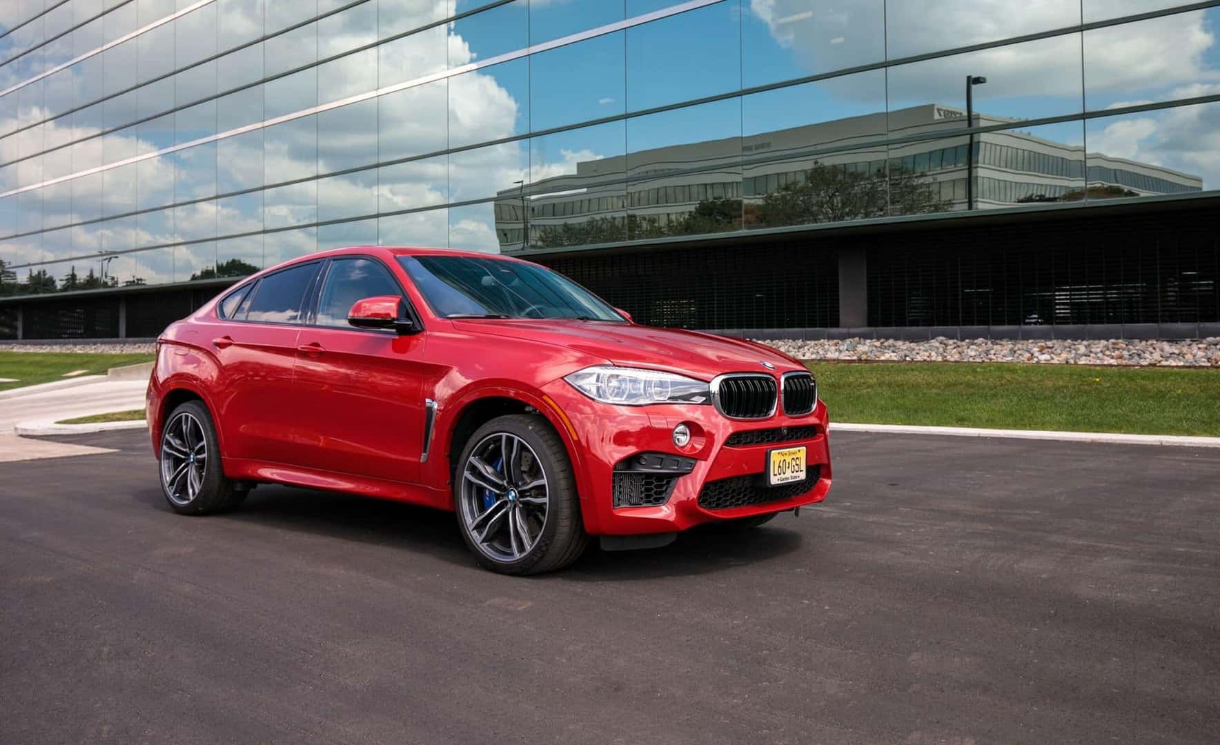The Luxury SUV, The 2017 BMW X6, Parked Outside A Reflective Glass Building