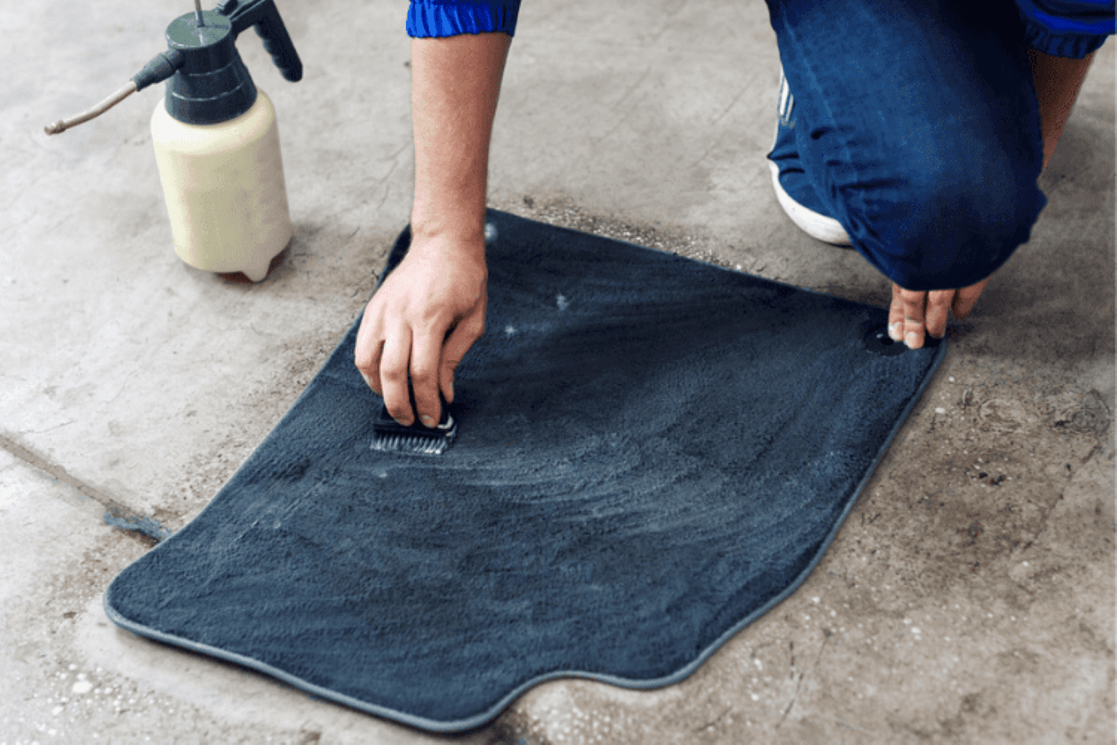 A Car Owner Cleaning Their Floor Mats With Specialized Cleaning Products For Car Interiors