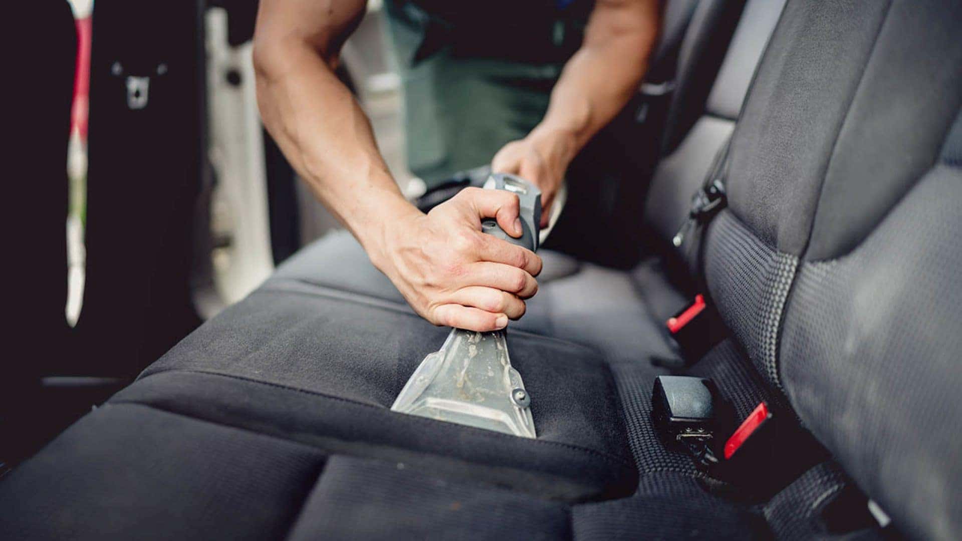A Car Owner Cleaning Their Car Interior With A Cleaning Tool. I Have No Idea What That Cleaning Tool Is. Also, Is It Me Or The Way The Arms And Hands Of The Car Owners Are Bending Weird?