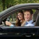 Two Teen Drivers Cruising On The Road