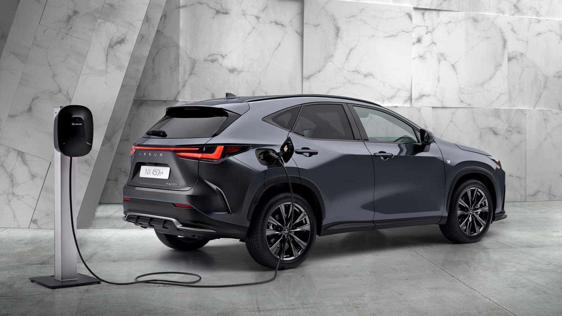 The Fabulous And Fuel-Efficient Lexus NX PHEV Charging In An Indoor Charging Station, Parked Inside A Wondrous Marble Building