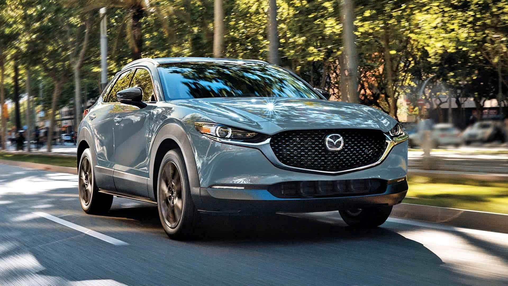The Comfortable And Affordable Mazda CX30 Driving Down Residential Streets 
