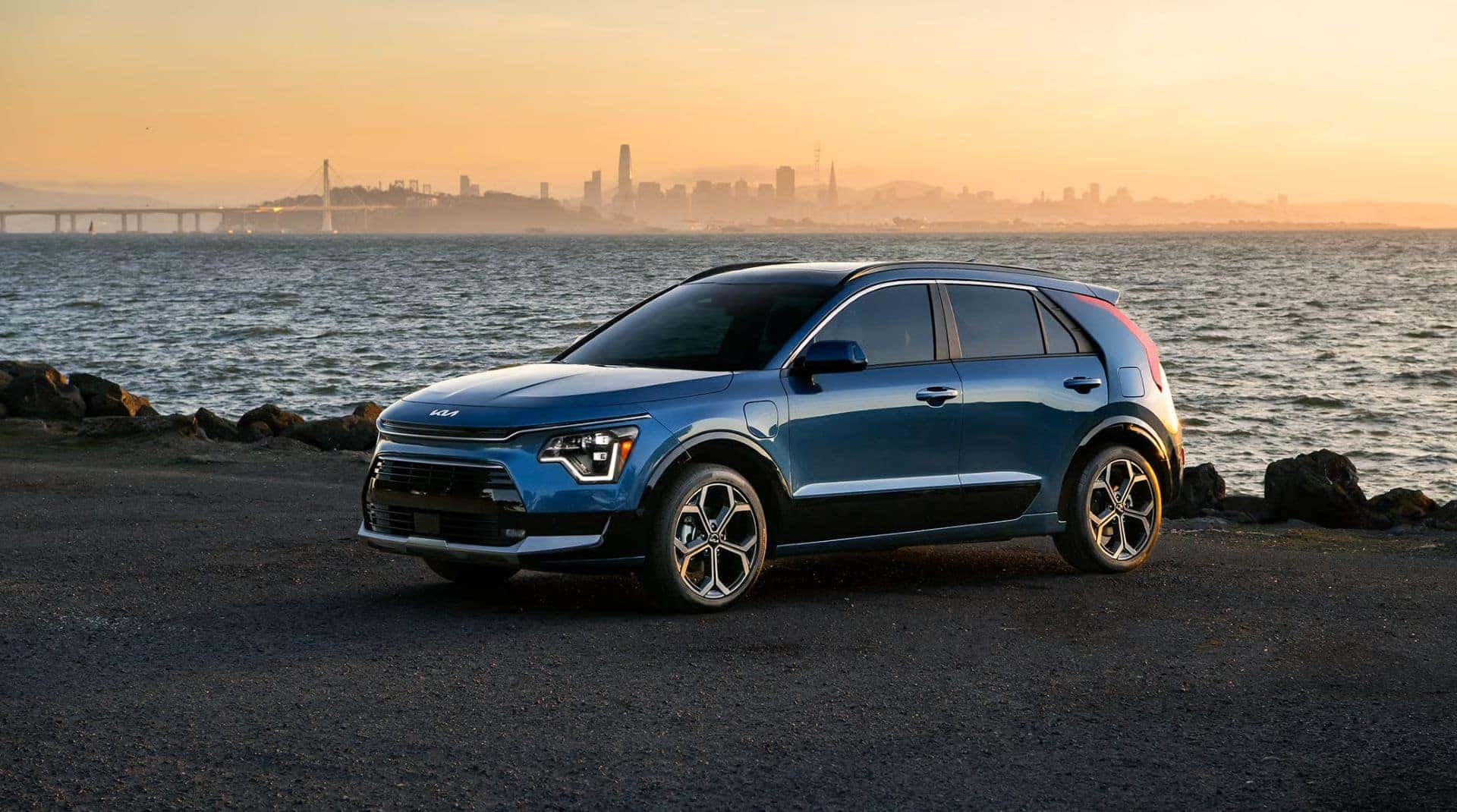 The Affordable And Easily Insurable Hybrid Kia Niro Parked On The Edge Of Lake