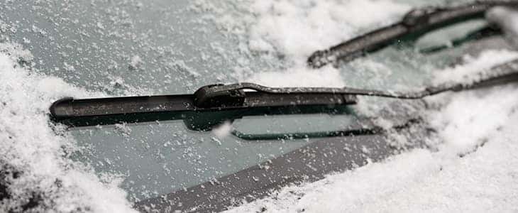 Windshield wipers wiping ice and snow