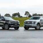 The Notable And Star 2024 Ford Ranger Duo Parked In A Rained-In Parking Lot, Near A Mound Of Dirt And Grass, With Outstanding Trees In The Distance
