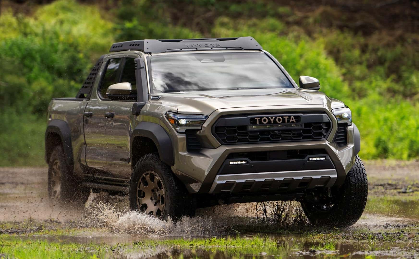 The Useful And Skilled 2024 Toyota Tacoma Trailhunter Driving Through Mud And Rain Sludge