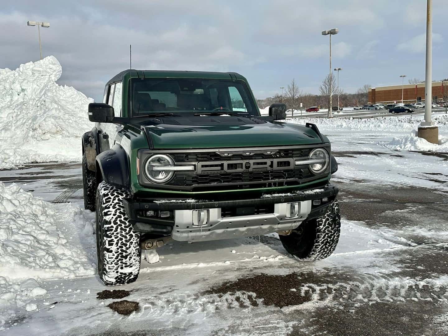 The Dependable Ford Bronco, Parked In A Snowed Parking Lot
