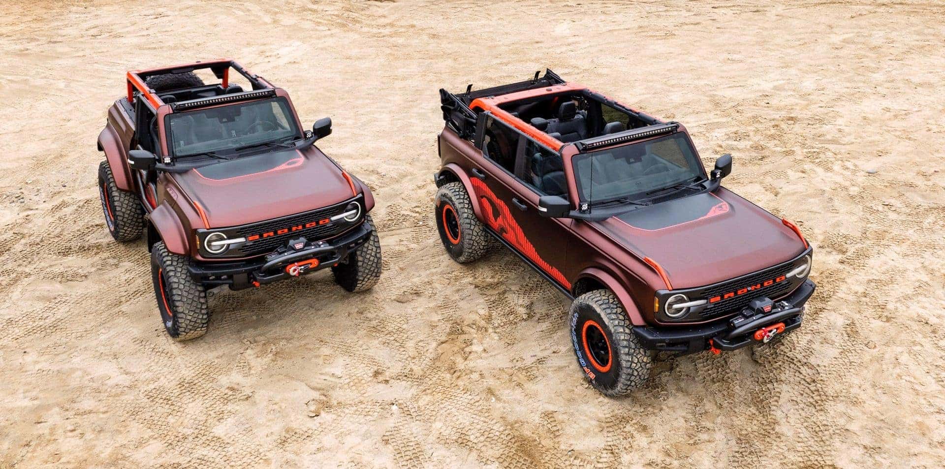 Two Powerful Ford Bronco, Parked In The Middle Of A Desert