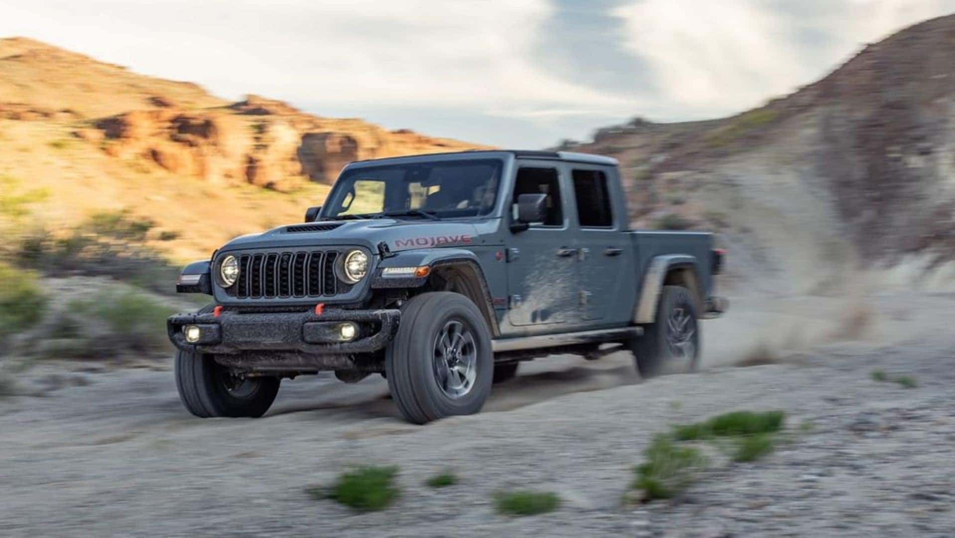 The Capable And Top-Notch Jeep Gladiator Mojave X, Blowing Off Dust As It Drives Through The Canyon's Valley