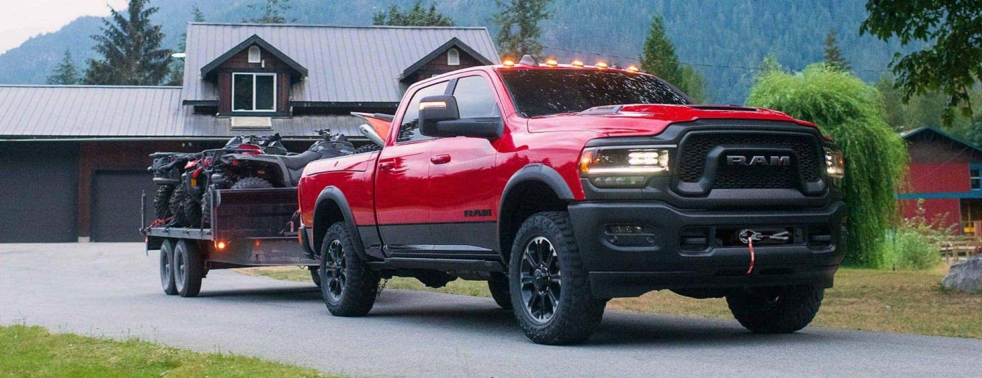 The Strong And Robust Ram Heavy Duty Rebel, Towing A Trailer Out Of Home's Driveway