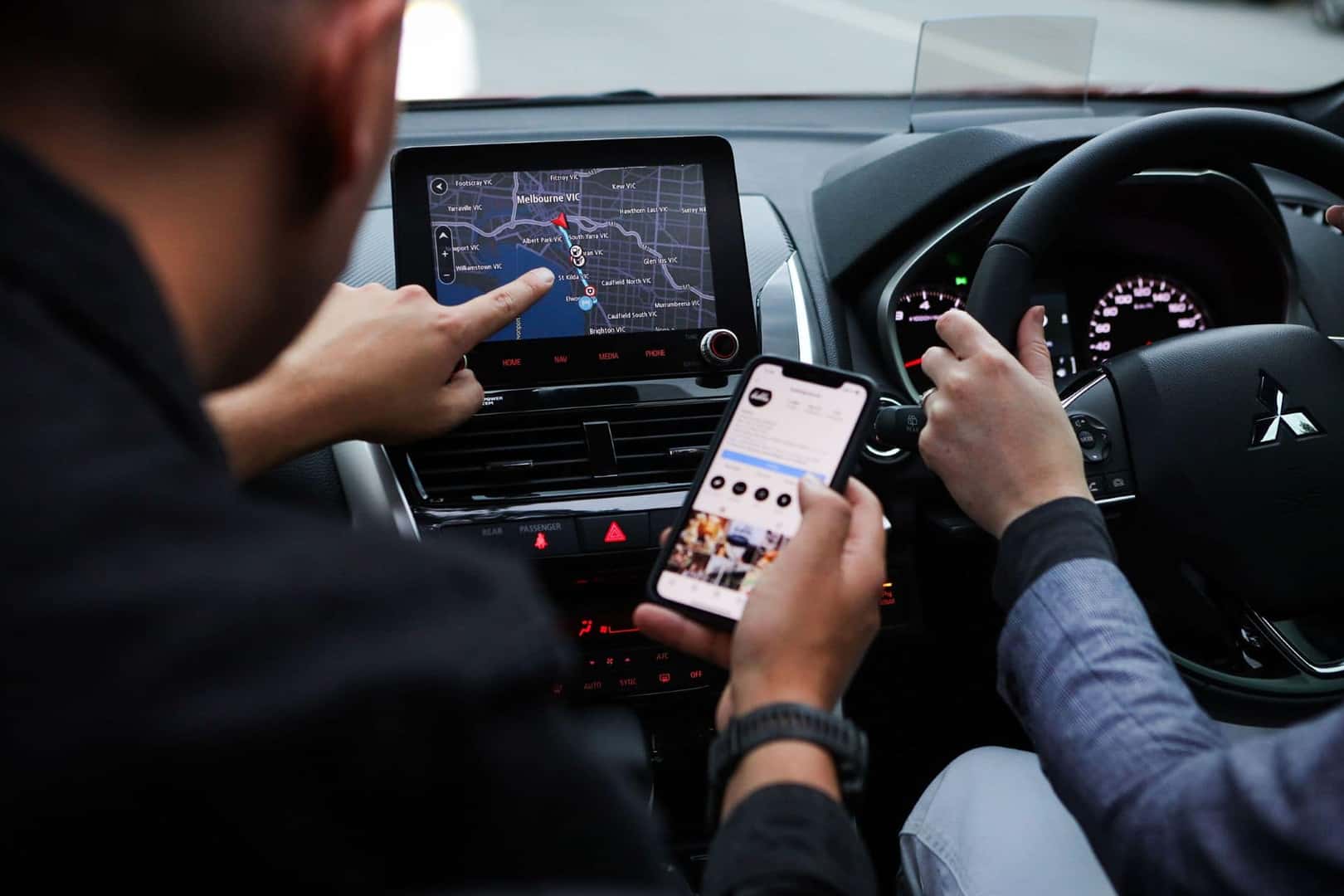 A Customer Connecting Their Phone To A Used Car, To Check If The Phone Interface Works