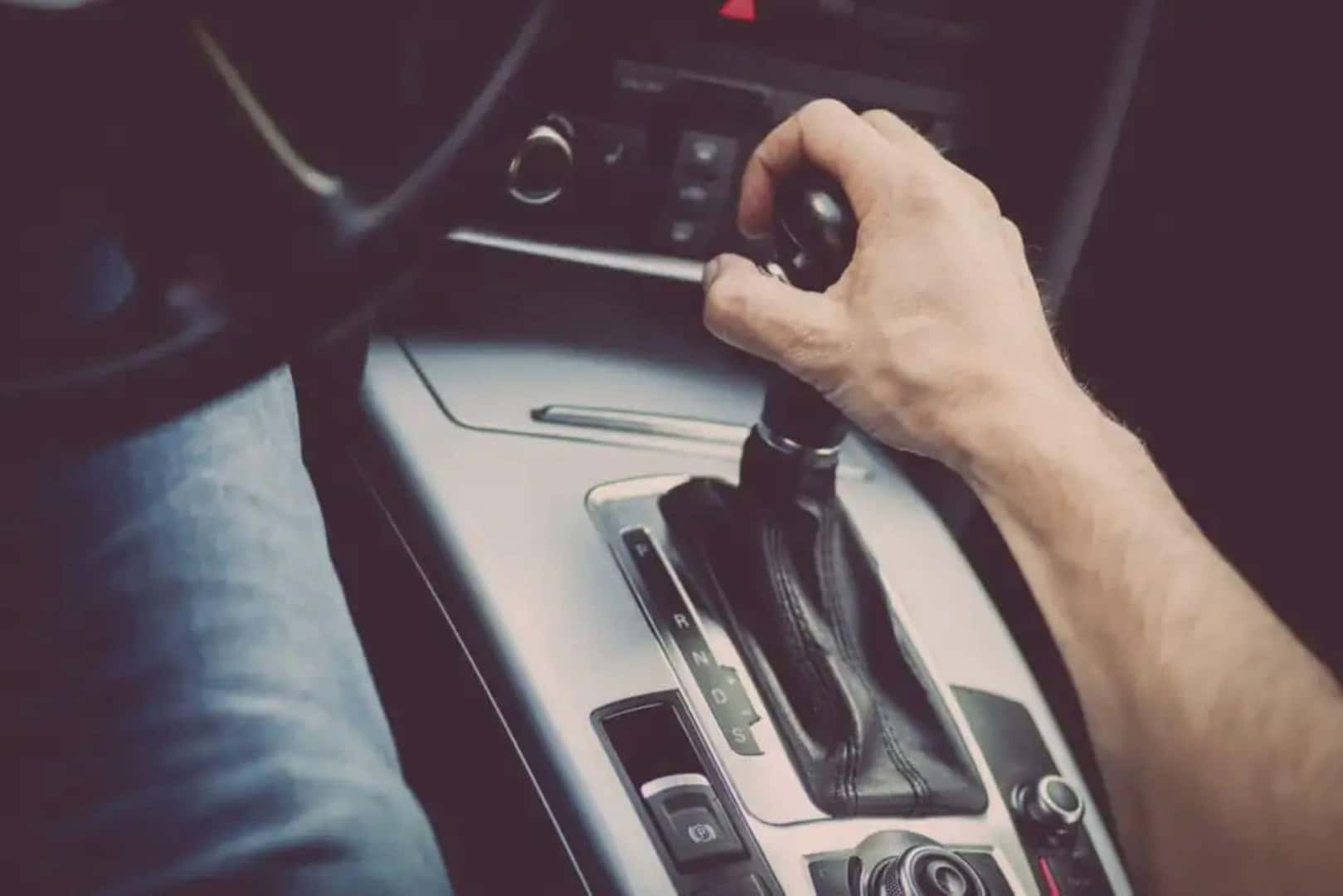 A Man Shifting The Car's Transmission, Checking If The Transmission Is Hard To Shift Or Jerky