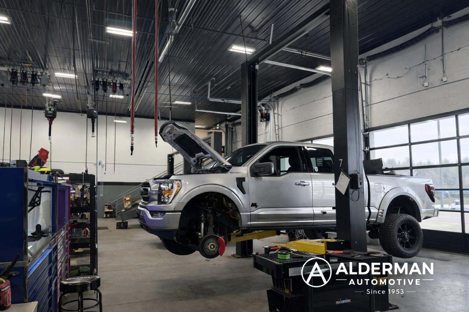 Alderman Automotive Service Center with Ford F150 raised