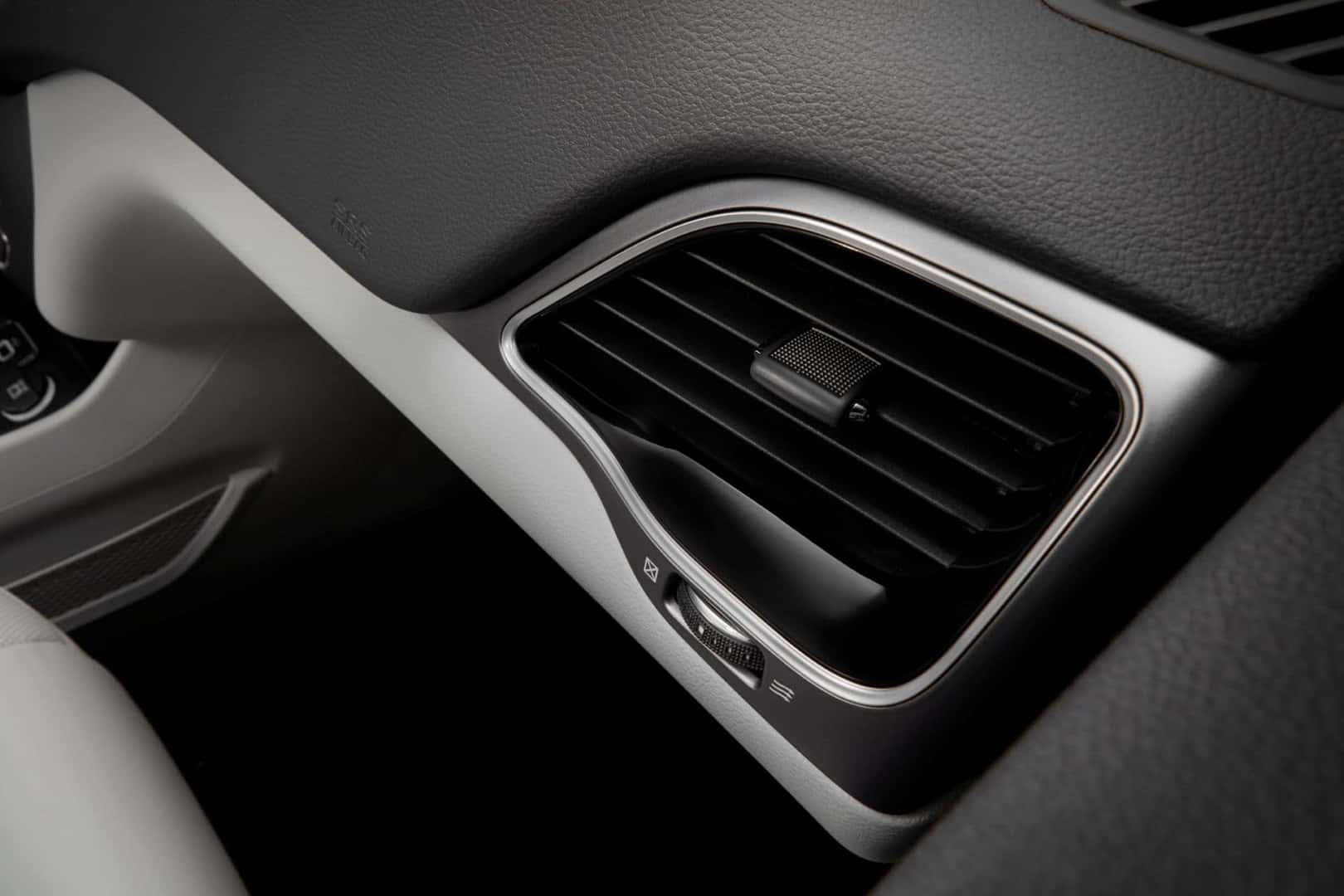 A Cool-Blowing Vent On A Sleek Black Dash