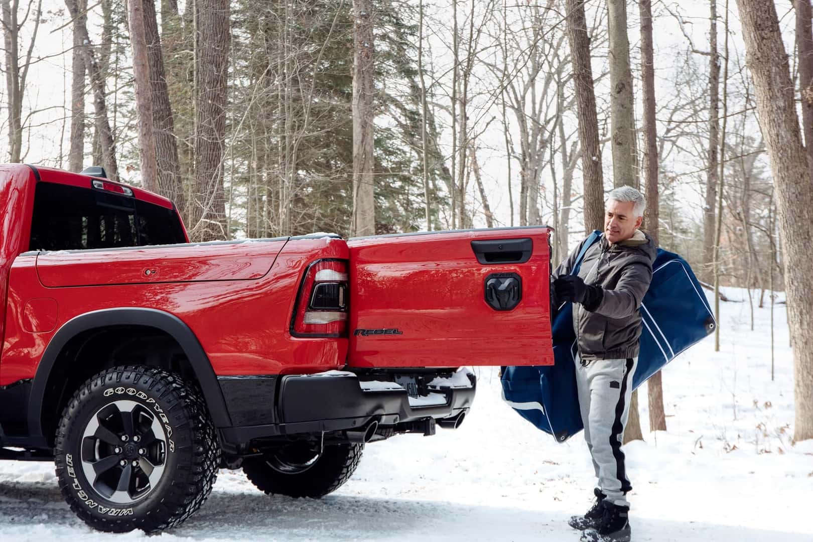 Man Opening Tailgate Door