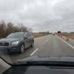 Used AWD SUV merging on I-69 near Fishers Indiana on an overcast autumn commute day