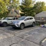 Used Toyota RAV4 and Ford Bronco four-door parked side by side near Geist Waterfront Park in Fishers, Indiana