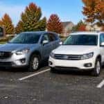 Used Mazda CX-5 and Volkswagen Tiguan parked side by side in Fishers Indiana for comparison