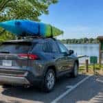 2023 crossover SUV with kayaks parked at Geist Waterfront Park in Fishers Indiana