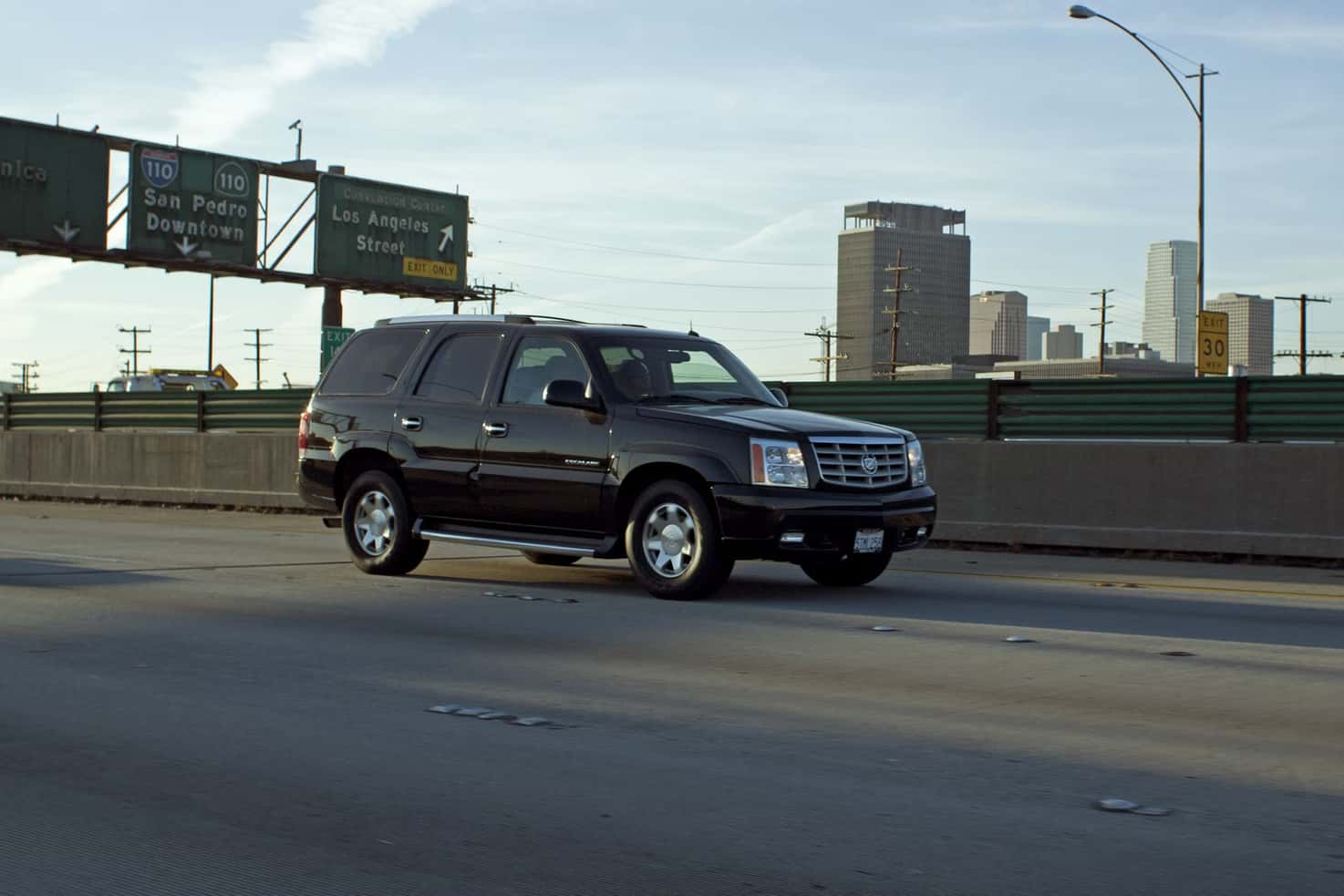 Black SUV driving on a highway