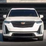 White Cadillac XT6 parked in a driveway