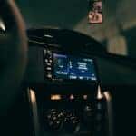 A dashboard of a car with a digital screen